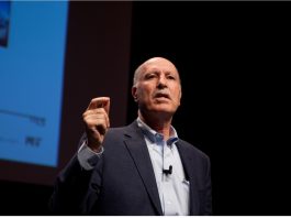 MIT Professor Yossi Sheffi speaking at a global electronics industry conference on AI and supply chain resilience